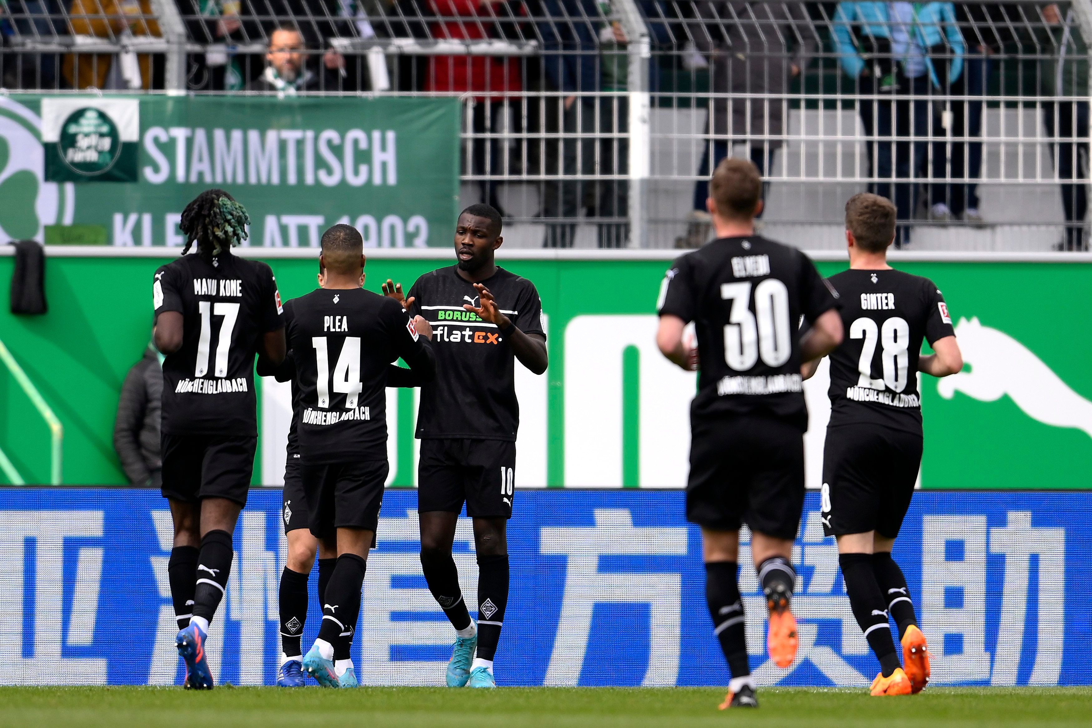 FUERTH, GERMANY - APRIL 09: Marcus Thuram of Borussia Moenchengladbach celebrates after scoring their side's first goal with team mates during the Bundesliga match between SpVgg Greuther Fuerth and Borussia Moenchengladbach at Sportpark Ronhof Thomas Sommer on April 09, 2022 in Fuerth, Germany. (Photo by Daniel Kopatsch/Getty Images)