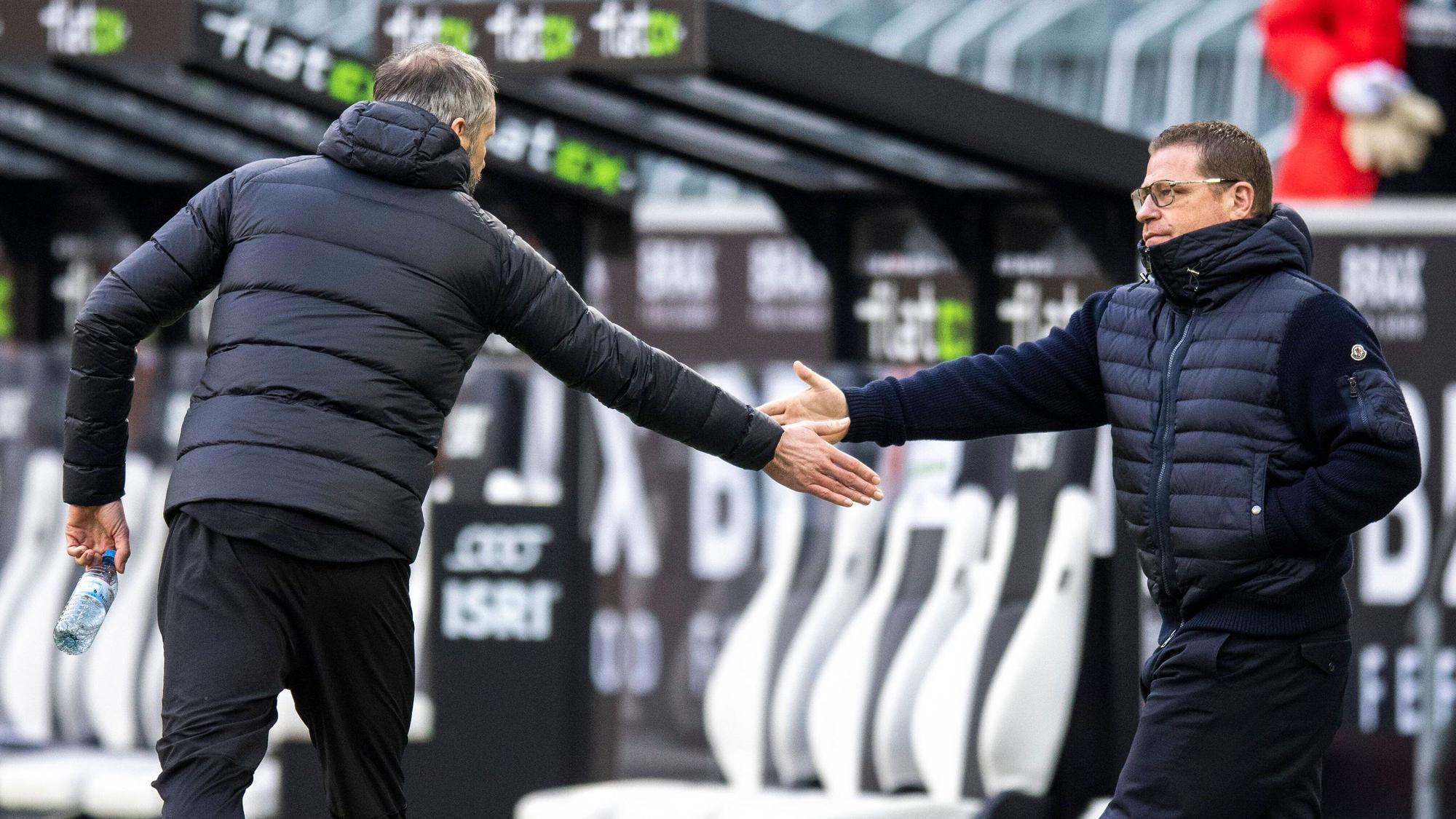 „Best Friends“ bald wieder vereint? Marco Rose (l.) und Max Eberl (r.) verbindet nicht nur die gemeinsame Vergangenheit bei Borussia Mönchengladbach. Eberl und Rose reichen sich in diesem Bild gegenseitig die Hand.