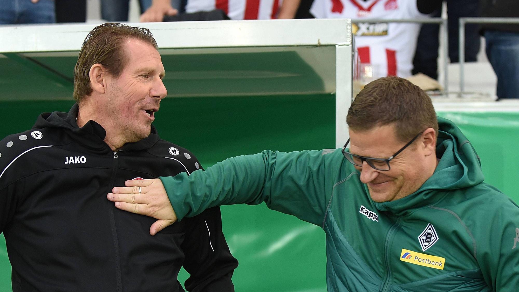 Sven Demandt und Max Eberl bei einer freundschaftlichen Begrüßung.